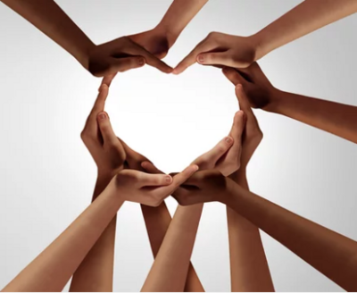 Multiple hands forming a heart symbolizing healing, compassion, and community support through Bella Medical Associates’ Navigating Through Grief Program— a 4-week journey to rediscover hope, strength, and emotional resilience.